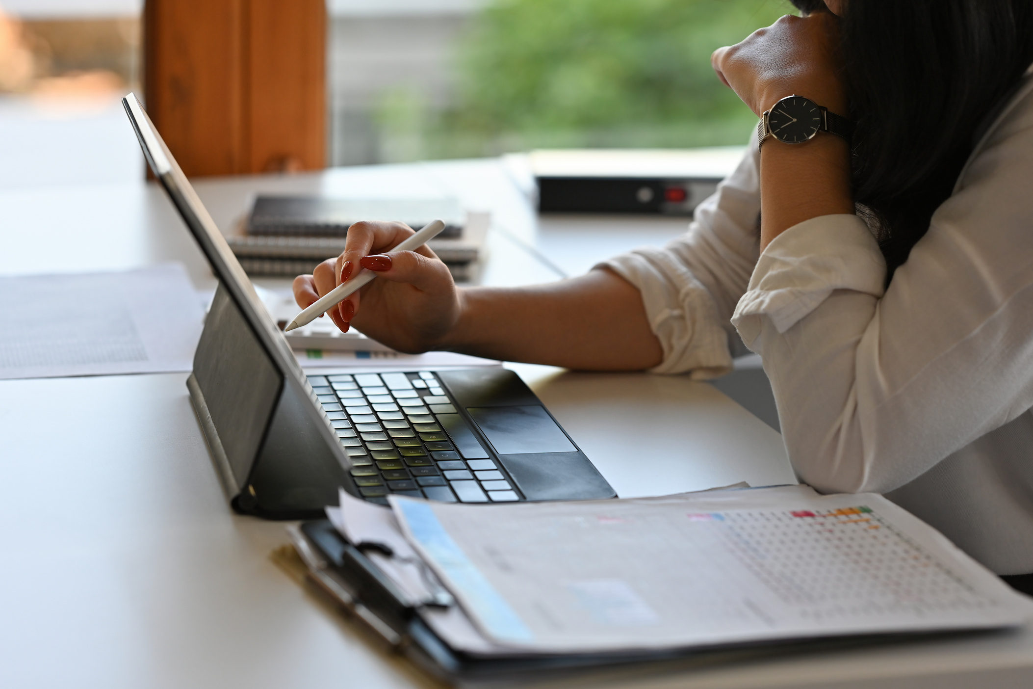 Close up with Businesswoman using digital tablet for analyze